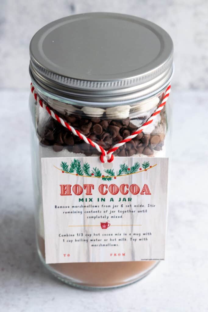 Jar of hot cocoa mix with Christmas gift tag.