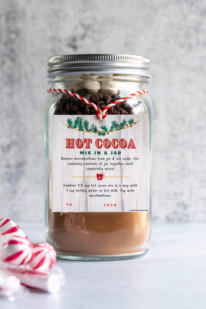 Homemade hot cocoa mix in a mason jar with gift tag.
