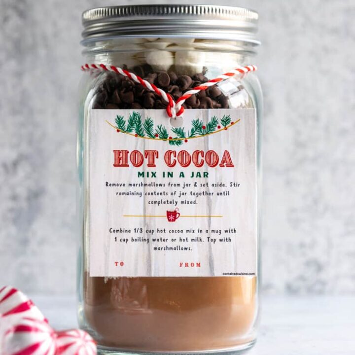 Homemade hot cocoa mix in a mason jar with gift tag.