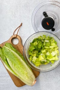 Oxo salad spinner being used to wash romaine lettuce.