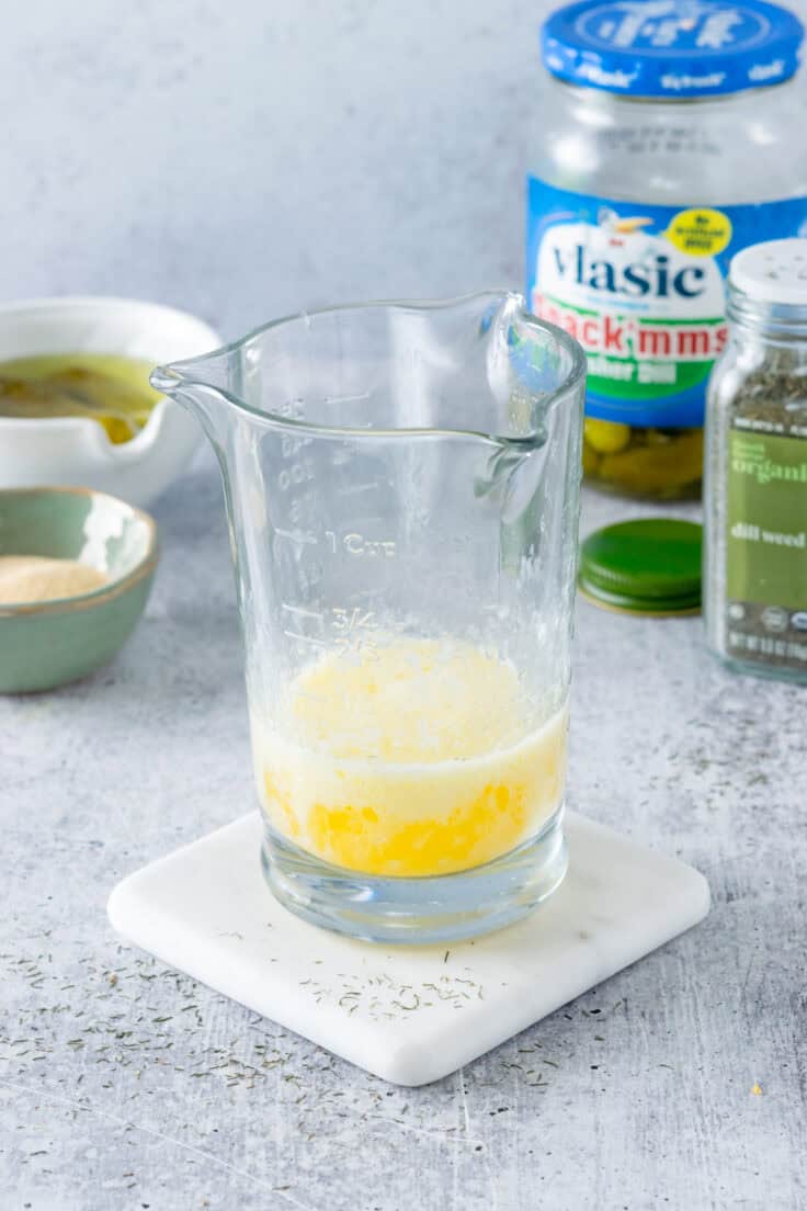 Melted butter in a glass measuring cup.