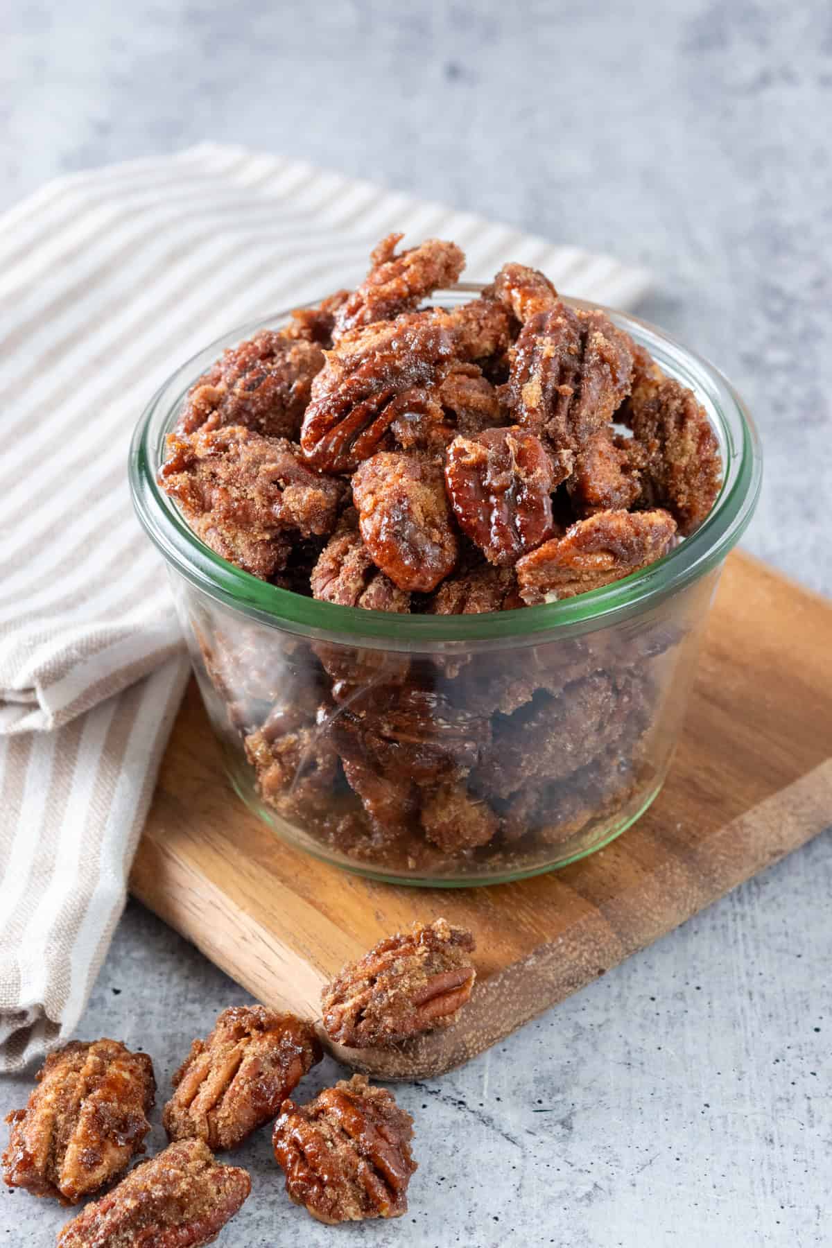 Bowl of homemade cinnamon sugar pecans that were candied on the stovetop.