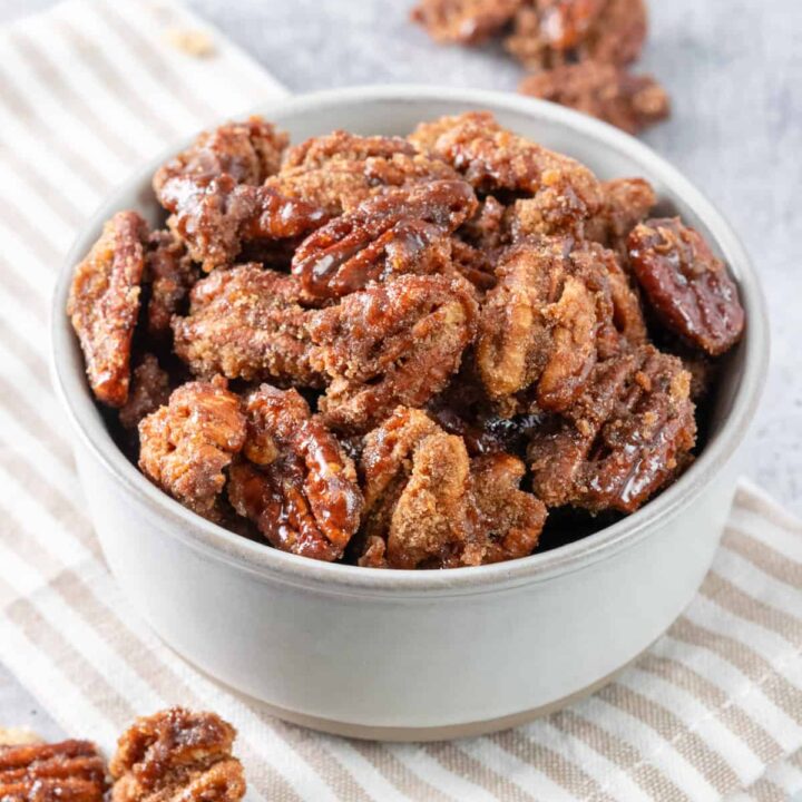 Bowl of homemade cinnamon sugar candied pecans.