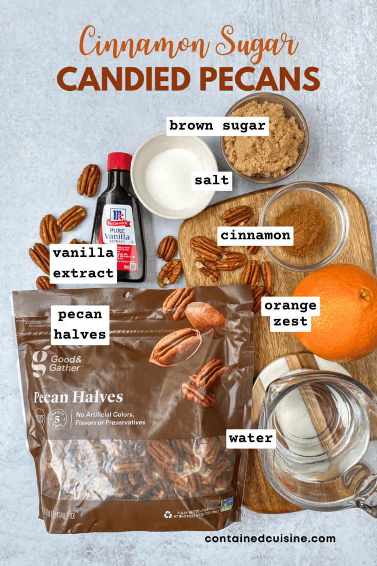 An overhead picture showing all the ingredients needed to make stovetop candied pecans, including, bottle of vanilla extract, bag of pecan halves, an orange and small bowls with salt, cinnamon, brown sugar and water.