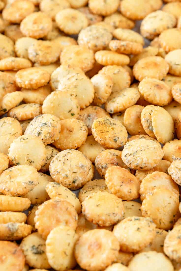 Close up picture showing ranch oyster crackers on a tray after coming out of oven.