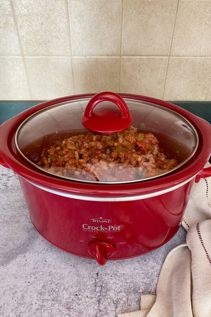 Cooking slow cooker turkey chili in a Crock Pot with the lid on.