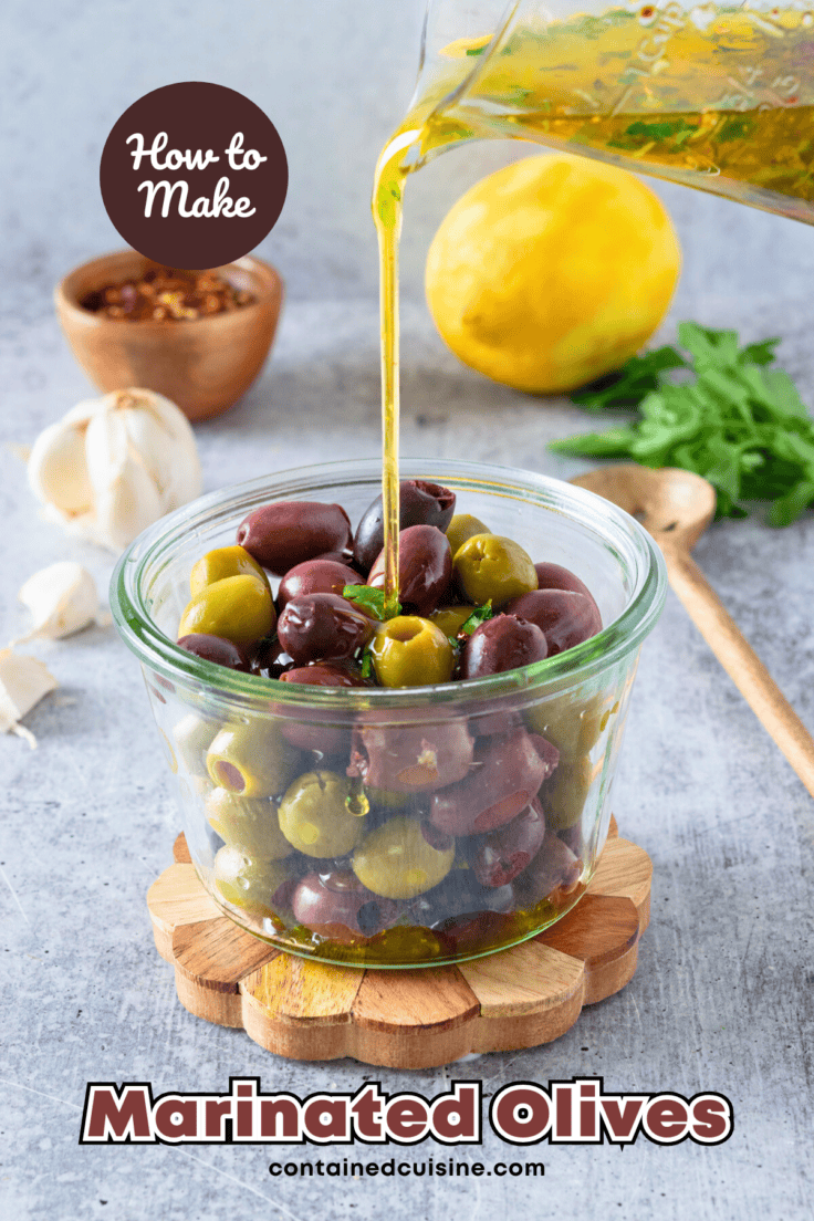 Homemade olive oil marinade being poured over bowl of black and green olives to make marinated olives. The picture has text overlay that says, how to make marinated olives.