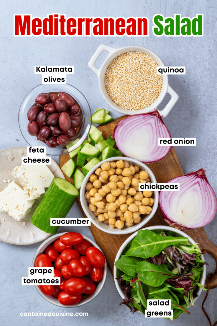 An overhead picture showing all the ingredients to make Mediterranean salad including bowls of quinoa, olives, chickpeas, grape tomatoes, and lettuce, and crumbled feta cheese, chopped cucumber and red onion.