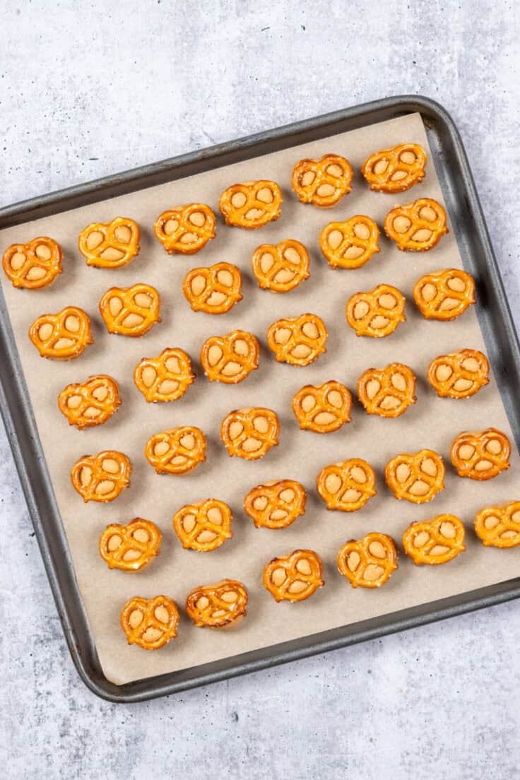 A pretzel added on top of each peanut butter ball to the 36 treats on the tray.