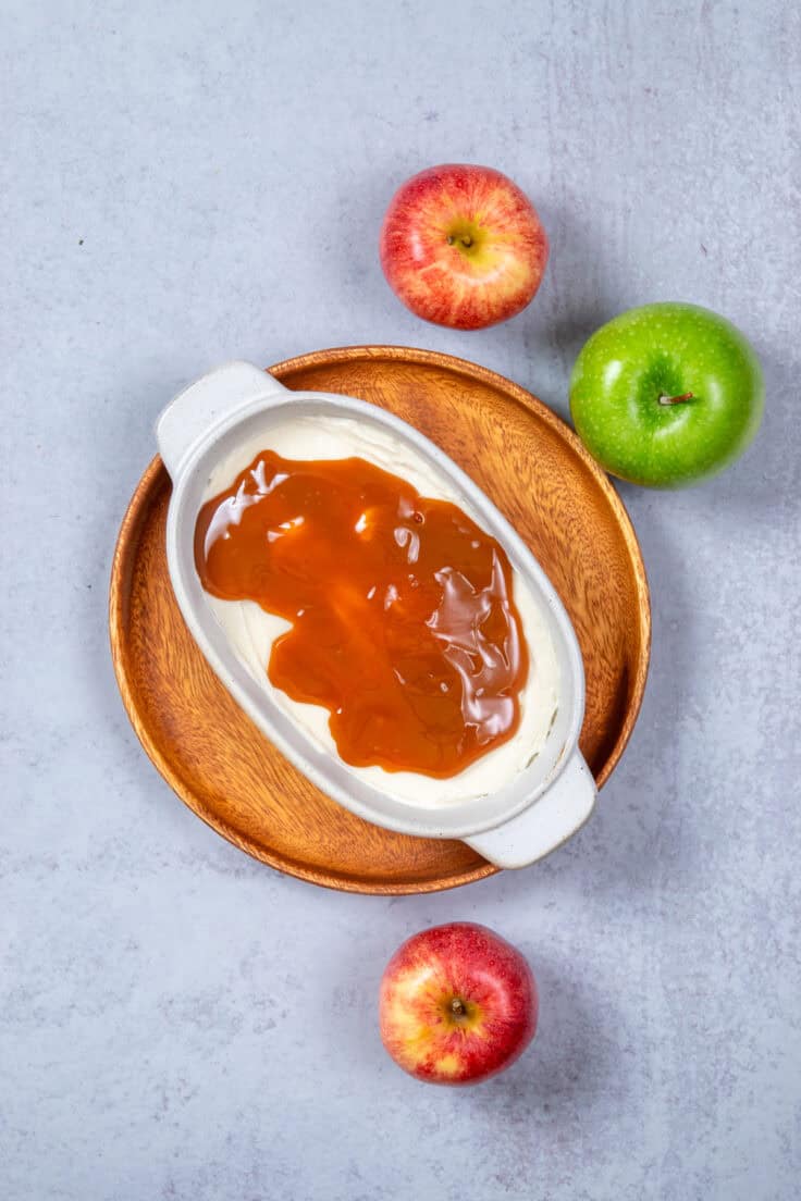 Caramel sauce spread over the cream cheese layer.