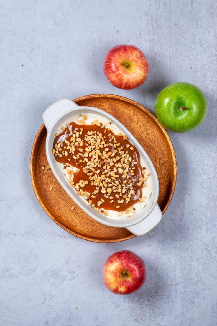 Nuts of toffee bits sprinkled on top of the caramel sauce.