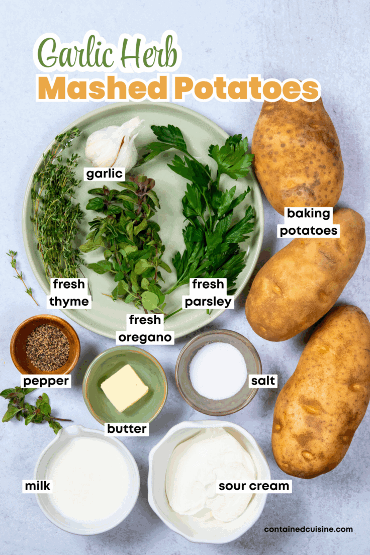 Ingredients for making the creamiest garlic mashed potatoes, including baking potatoes, garlic, fresh thyme, oregano and parsley, salt and pepper, butter, milk and sour cream. The image has text overlay that reads, "Garlic Herb Mashed Potatoes."