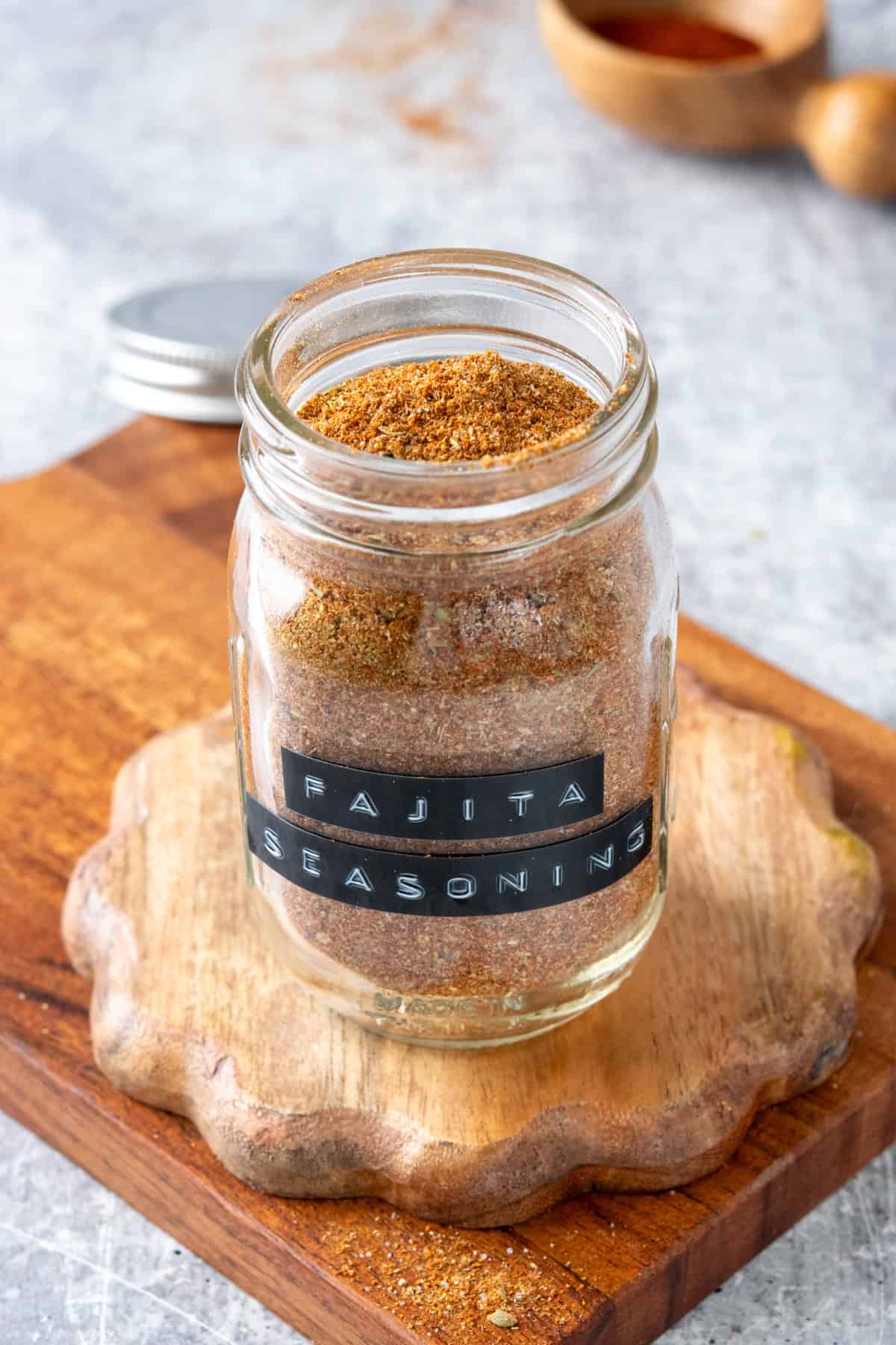 Labeled spice jar filled with homemade fajita seasoning spice mix.