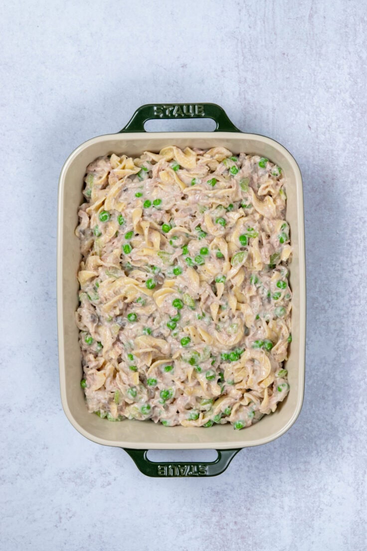 Assembled tuna noodle casserole in baking dish.