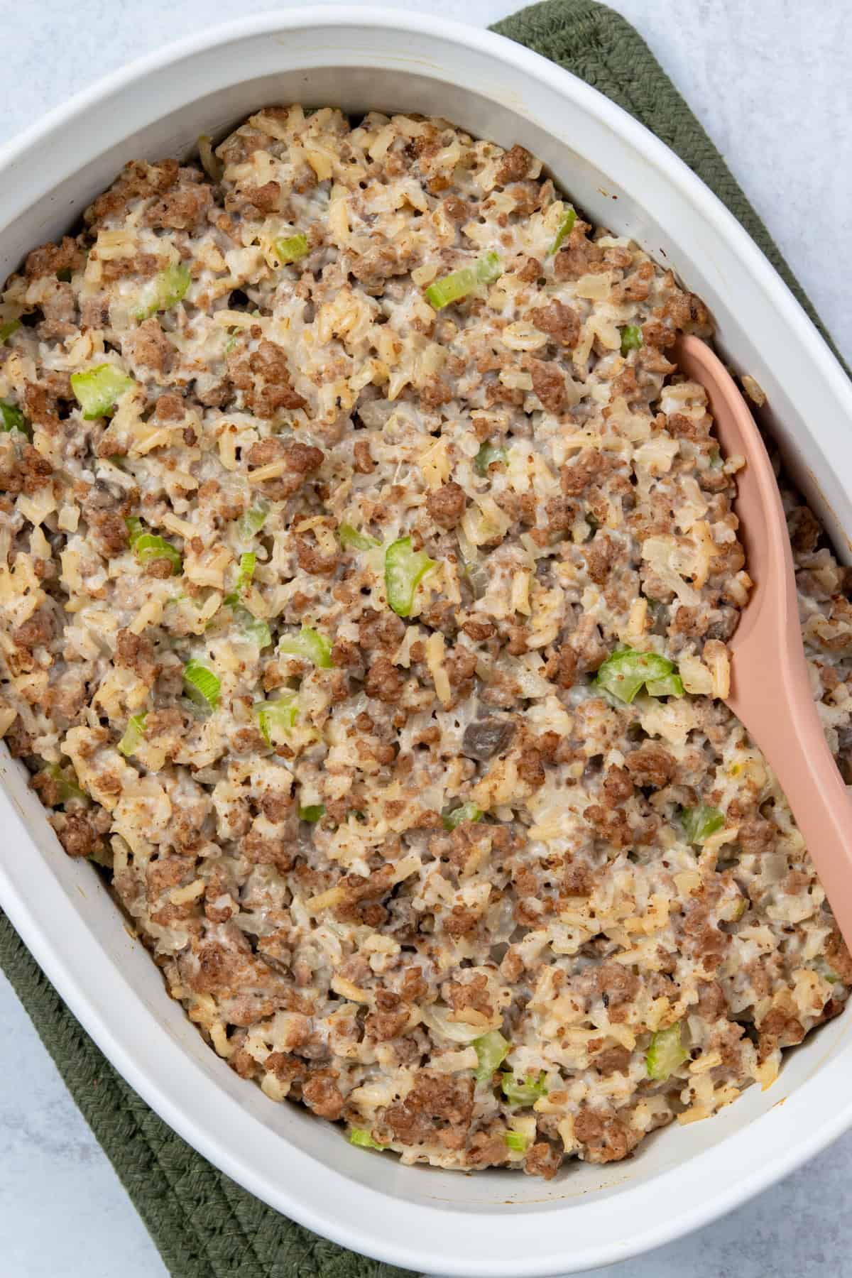 The finished hamburger rice casserole in a 1.5 quart dish, golden brown and ready to serve.