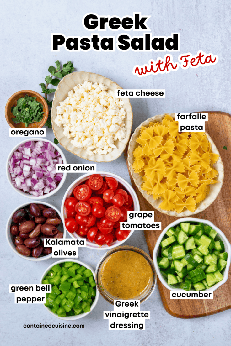 Labeled ingredients for Greek pasta salad with feta including pasta, vegetables, olives, and cheese arranged for prep.