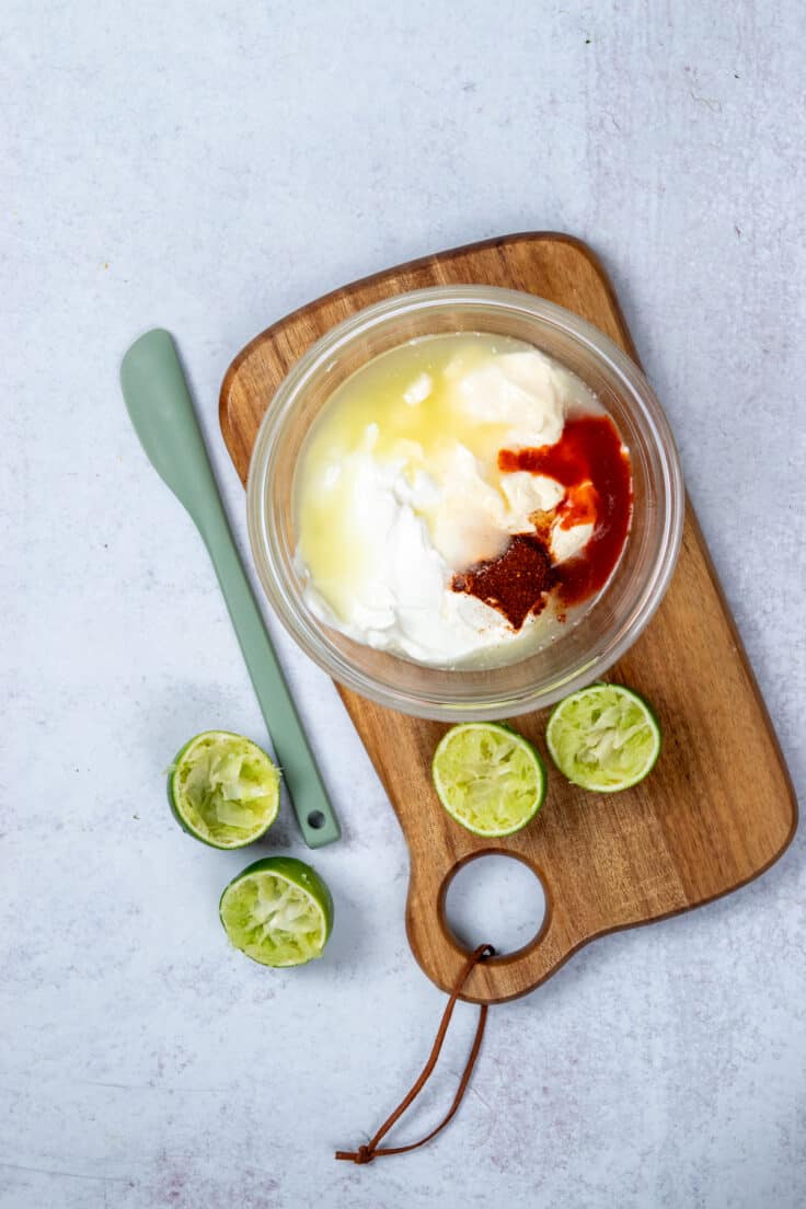 Unmixed creamy chili lime pasta salad dressing in a small bowl.