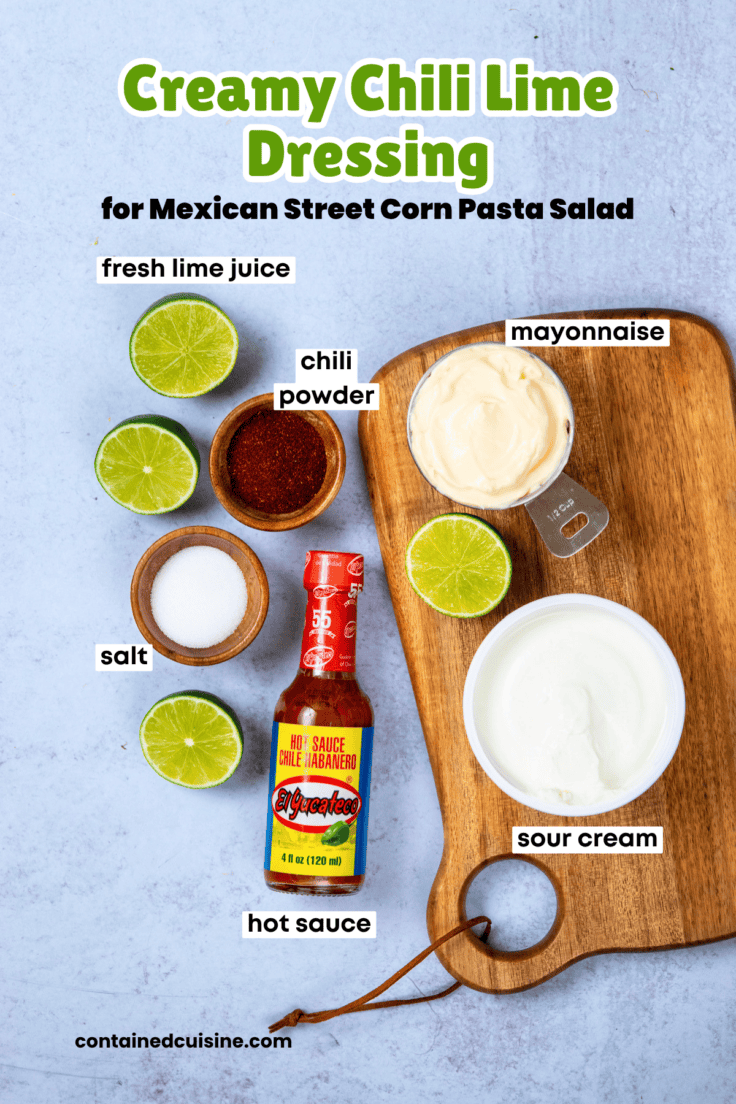 Overhead photo of labeled ingredients for creamy chili lime dressing including mayonnaise, sour cream, lime juice, chili powder, Mexican hot sauce, and salt arranged in small bowls.