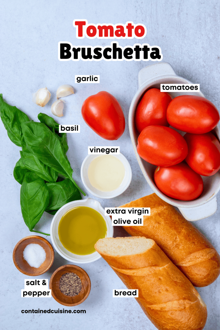 Labeled ingredients needed to make classic tomato bruschetta including tomatoes, basil, garlic, olive oil, and crusty bread.