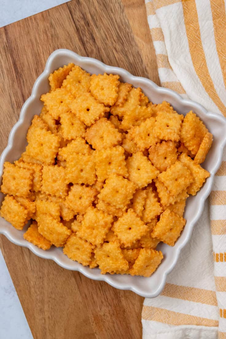 Serving bowl filled with crispy homemade Cheez-Its made with real sharp cheddar cheese and baked until golden.